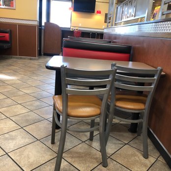 Carl's Jr - a table and chairs in a restaurant - Fast Food Near Me - Post Falls, Idaho