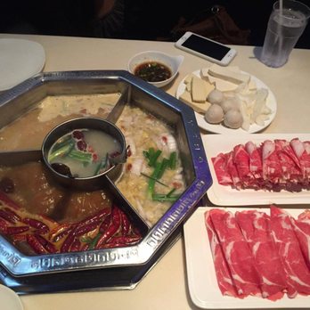 Boiling Hot Pot - Pork bone soup in the middle, miso soup, pickled lettuce, and spicy soup on the outsides. - Hot Pot Near Me - San Francisco, California