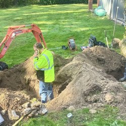 Envirotek - Technicians Brian and Tim unearthing hidden tank and distribution box