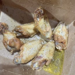 Soggy wings with very little seasoning swimming in a pool of oil