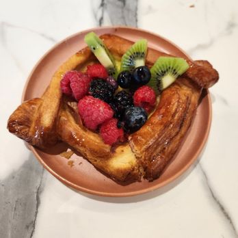 Gourmet Central Bakery - a plate of french toast with berries and kiwi - Coffee & Tea Near Me - Prunedale, California Gourmet Central Bakery - a plate of french toast with berries and kiwi - Coffee & Tea Near Me - Prunedale, California