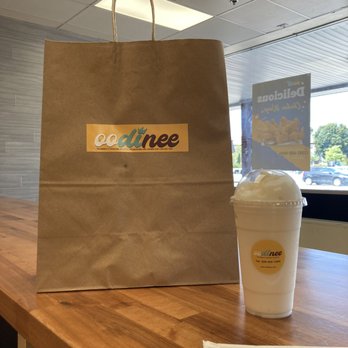 Oodinee - a paper bag and a cup of coffee - Caribbean Near Me - Rockland, Massachusetts