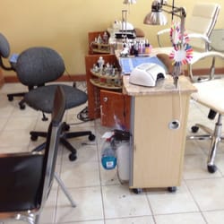 Lux Nails - Dirty and workers sitting around with their feet on the chair
