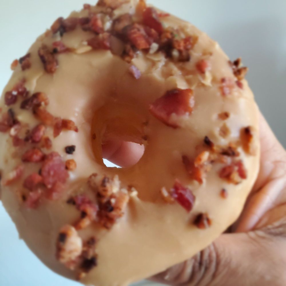 Dynamite Donuts - Sweet Piggy. Maple glaze topped with bacon. Bacon makes everything better. This was delicious. - Donuts Near Me - Hercules, California Dynamite Donuts - Sweet Piggy. Maple glaze topped with bacon. Bacon makes everything better. This was delicious. - Donuts Near Me - Hercules, California