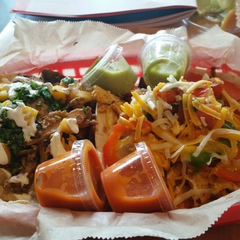 Torchy's Tacos - Brushfire taco - jerk chicken, mango, sour cream, grilled jalapeño. Chicken Fajita taco. Diablo & Avocado sauces - Tex-Mex Near Me - Dallas, Texas Torchy's Tacos - Brushfire taco - jerk chicken, mango, sour cream, grilled jalapeño. Chicken Fajita taco. Diablo & Avocado sauces - Tex-Mex Near Me - Dallas, Texas