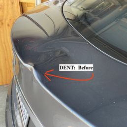Nasty dent right on the edge of my rear spoiler.
