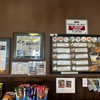 Half and Half Tea Express - The image shows a menu board in a bubble tea shop, featuring a variety of half-and-half tea drinks with detailed descriptions and images. The menu includes options like iced milk tea with pudding, milk tea with pudding and honey, and other flavored teas. Additional signage includes a top 5 boba tea list, a sign about reserving the right to refuse service, and snack packages at the bottom. The setting appears to be indoors with a wooden wall and various informational and promotional signs. - Coffee & Tea Near Me - Pasadena, California