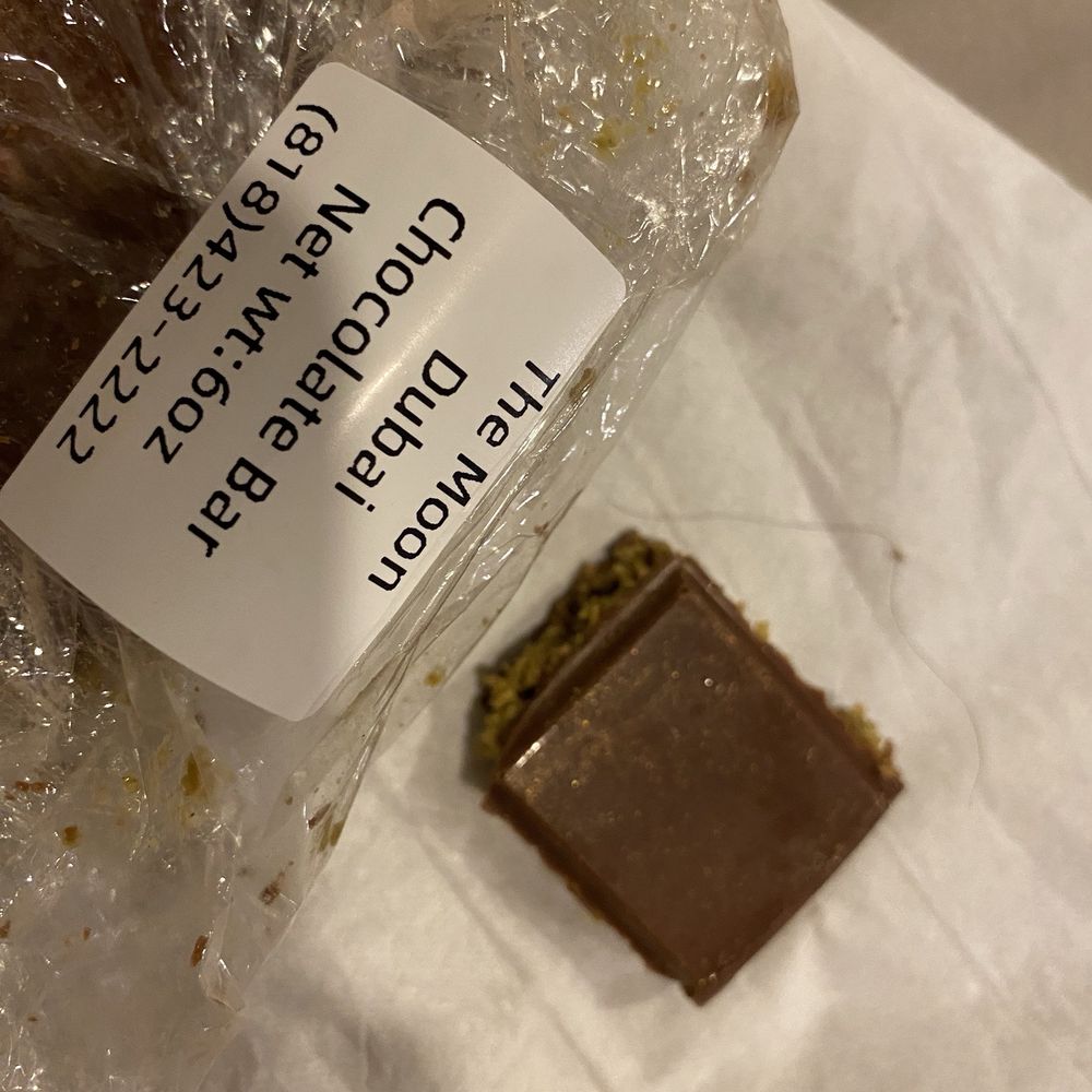 The Moon - Dubai chocolate bar hair was stuck inside. I'm bummed it was a good first bites. Then found this in the middle. 12/2024 - Coffee & Tea Near Me - North Hollywood, California The Moon - Dubai chocolate bar hair was stuck inside. I'm bummed it was a good first bites. Then found this in the middle. 12/2024 - Coffee & Tea Near Me - North Hollywood, California
