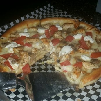 Landon's Pub and Pizza - The "Shelly" specialty pizza. White garlic sauce, ricotta, chicken,tomato, mushroom. Yum. The crust is perfect. - Bars Near Me - Watkins Glen, New York Landon's Pub and Pizza - The "Shelly" specialty pizza. White garlic sauce, ricotta, chicken,tomato, mushroom. Yum. The crust is perfect. - Bars Near Me - Watkins Glen, New York