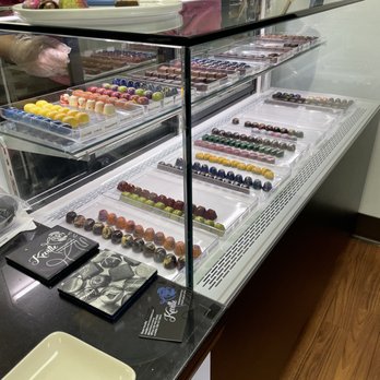 Keville Handcrafted Chocolates - a man sitting at a counter - Chocolatiers & Shops Near Me - Malta, New York Keville Handcrafted Chocolates - a man sitting at a counter - Chocolatiers & Shops Near Me - Malta, New York