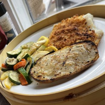 Fishlips - Butter crusted cod with mixed veggies and dry sandpaper baked potato - Bars Near Me - Cape Canaveral, Florida Fishlips - Butter crusted cod with mixed veggies and dry sandpaper baked potato - Bars Near Me - Cape Canaveral, Florida