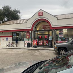 a car parked in front of a fast food restaurant a car parked in front of a fast food restaurant