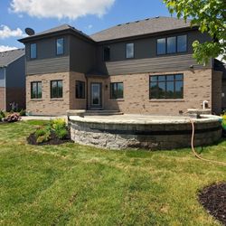 Hope's Landscaping - Woodridge- Sierra Westport with Series 3000 black accent and Sandstone Brussels edge 3 tier patio with step down firepit area and seatwall