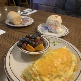 Linguica omelette with melted cheddar cheese, side of fresh fruit, & biscuit Linguica omelette with melted cheddar cheese, side of fresh fruit, & biscuit