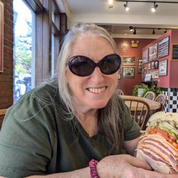 Nancy Potter Black  enjoying half of a 6 inch destroyer.  No one makes it better. We  drove from NC.  and had to stop in