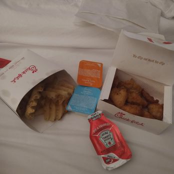 Chick-fil-A - ows a bag of chicken nuggies and a packet of chicken nuggies - Fast Food Near Me - Erie, Pennsylvania