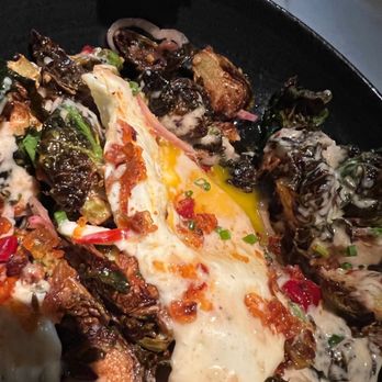Ella Elli - Crispy fried Brussel sprouts with an over easy egg. Huge yum-factor. - Wine Bars Near Me - Chicago, Illinois
