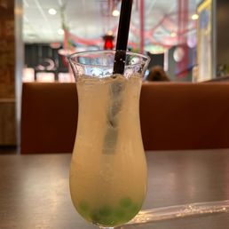 a drink in a glass on a table