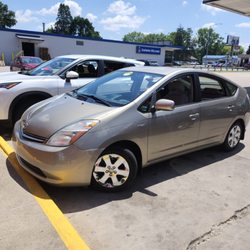 Mad Hatter Auto Service - Car we got next to car we rented to get there. (We live in Duluth, MN).