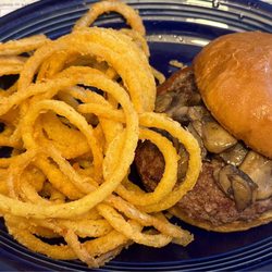 Mushroom burger cooked to perfection along with handmade onion rings