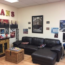Jan's Barber Shop - Jan's Barber Shop. One of the comfy sitting areas with a view to a hanging tv.