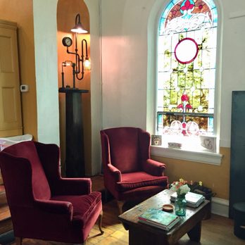Steeple Coffee House - living room with stained glass window - Coffee & Tea Near Me - Monticello, Illinois Steeple Coffee House - living room with stained glass window - Coffee & Tea Near Me - Monticello, Illinois