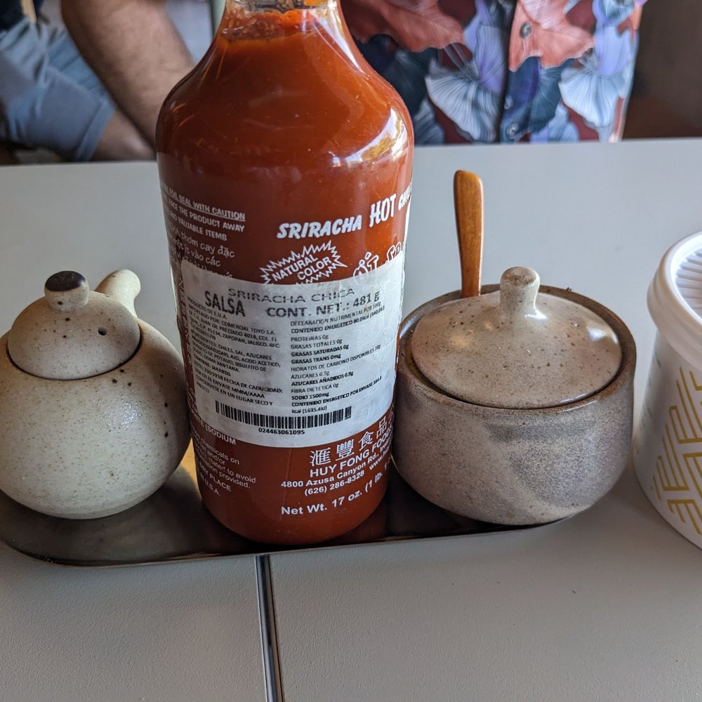Hato - Of course there's a bottle of sriracha. - Ramen Near Me - Guadalajara, JAL Hato - Of course there's a bottle of sriracha. - Ramen Near Me - Guadalajara, JAL