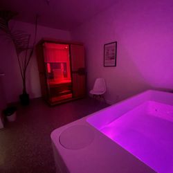 Immersion Therapy - Private room at night. Infrared sauna and cold plunge combo for contrast therapy.