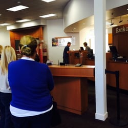 Bank of America Financial Center - One teller & the line is long! I've been standing in line for about 5 minutes now. There is about 4 people in front of me.