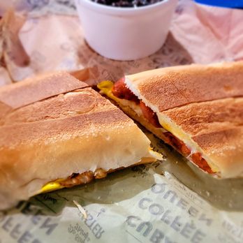 Cuban Coffee Queen - Egg, Cheese & Chorizo on Cuban bread - Breakfast sandwich with a side of black beans & rice - Coffee & Tea Near Me - Key West, Florida Cuban Coffee Queen - Egg, Cheese & Chorizo on Cuban bread - Breakfast sandwich with a side of black beans & rice - Coffee & Tea Near Me - Key West, Florida