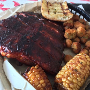 Buz And Ned's Real Barbecue - Spare ribs with cajun corn, fried okra, and a piece of grilled garlic bread. - Barbeque Near Me - Richmond, Virginia Buz And Ned's Real Barbecue - Spare ribs with cajun corn, fried okra, and a piece of grilled garlic bread. - Barbeque Near Me - Richmond, Virginia