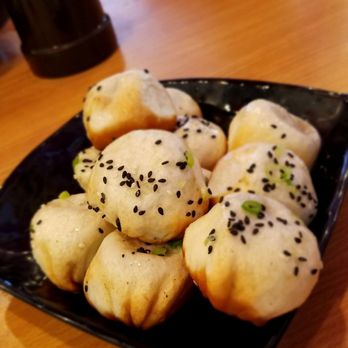 Shanghai Bistro - Signature pan fried pork buns with crispy outer crust. Be careful as it has hot soup content. Bite with cautious. $7 for six pieces - Shanghainese Near Me - Newark, California