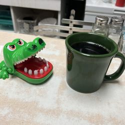 The Coffee Pot - Piping hot coffee. The gator is waiting for it to cool down.