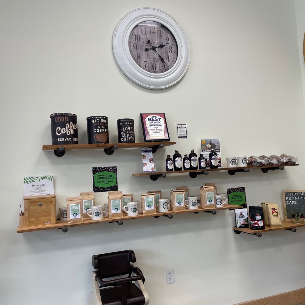 Thirteen Pennies Cafe - a clock and shelves of coffee - Coffee & Tea Near Me - Black Mountain, North Carolina Thirteen Pennies Cafe - a clock and shelves of coffee - Coffee & Tea Near Me - Black Mountain, North Carolina
