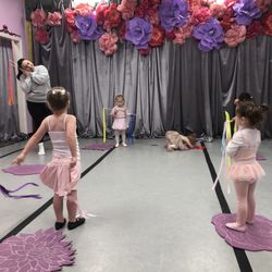 Lana's Dance Studio - Class with teacher, and warmup poses.