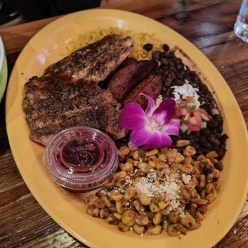 Wylie and Rum - Jerk chicken entree with street corn. Cannot remember what the sauce was. - Caribbean Near Me - Atlanta, Georgia