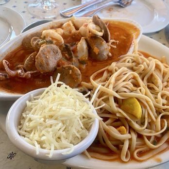 Sandbar & Grill - Tentacles and Tubes with a Sausage in a red sauce and Pasta with fresh grated Parmigiana. - Seafood Near Me - Monterey, California Sandbar & Grill - Tentacles and Tubes with a Sausage in a red sauce and Pasta with fresh grated Parmigiana. - Seafood Near Me - Monterey, California