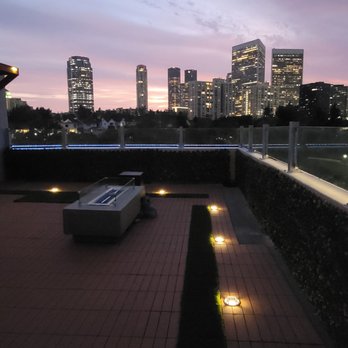 Siamor Construction Group - a view of a city at dusk - General Contractors Near Me