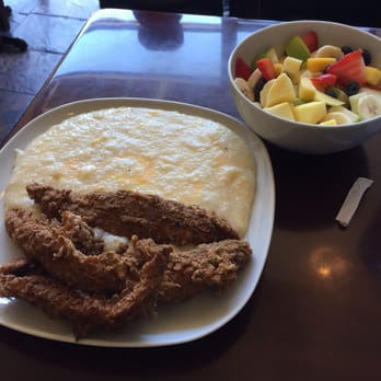 Shanes Brooklyn - Fish and grits with a huge side of seasonal fruit. - New American Near Me - Brooklyn, New York Shanes Brooklyn - Fish and grits with a huge side of seasonal fruit. - New American Near Me - Brooklyn, New York