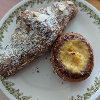 Grand Pere Bakery - Almond Croissant (Top), Tasse De Creme (Bottom) - Bakeries Near Me - Mountlake Terrace, Washington Grand Pere Bakery - Almond Croissant (Top), Tasse De Creme (Bottom) - Bakeries Near Me - Mountlake Terrace, Washington