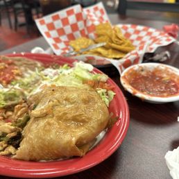 Part of the chimichanga, chips and salsa. His guacamole is long gone, it was so good! Part of the chimichanga, chips and salsa. His guacamole is long gone, it was so good!
