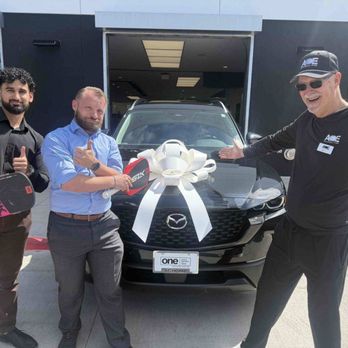 Schomp Mazda - Saad and Elijah on the left who were my salesman. Me on the right in my ACE PICKLEBALL club uniform. - Car Dealers Near Me - Aurora, Colorado Schomp Mazda - Saad and Elijah on the left who were my salesman. Me on the right in my ACE PICKLEBALL club uniform. - Car Dealers Near Me - Aurora, Colorado
