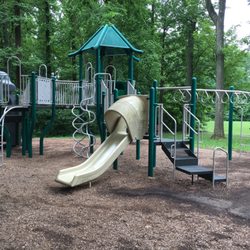 Providence Park - The other playground seeming for older children. Lots of trees around. Swings, pavilion and trash cans nearby.