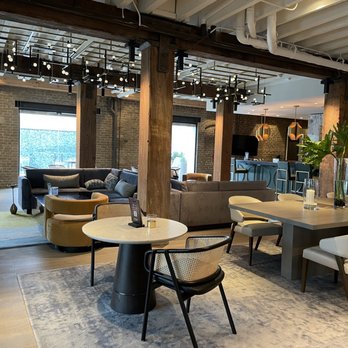One11 Hotel - Gorgeous combo of design with old sugar factory.  This is the bar/dining/chillin/get your complimentary coffee in the morning area to hang. - Hotels Near Me - New Orleans, Louisiana