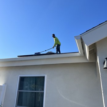 DoubleTake Solar Cleaning - On the roof cleaning the solar panels - Solar Panel Cleaning Near Me DoubleTake Solar Cleaning - On the roof cleaning the solar panels - Solar Panel Cleaning Near Me