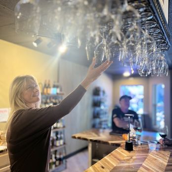 Wine Down Willamette - Co-owner Teri making work look down right zen. - Wine Bars Near Me - West Linn, Oregon