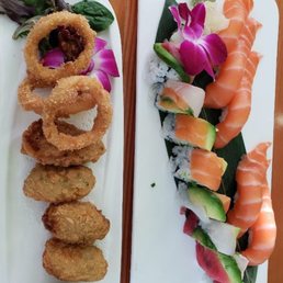 Salmon sushi, rainbow roll, fried oysters Salmon sushi, rainbow roll, fried oysters
