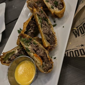 Woodson's Local Tap + Kitchen Grand Parkway - Philly Cheesesteak Eggrolls - American Near Me - Spring, Texas Woodson's Local Tap + Kitchen Grand Parkway - Philly Cheesesteak Eggrolls - American Near Me - Spring, Texas