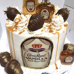 The Ultimate Bakery - Crown royal Vanilla cake with caramel drip and chocolate dipped strawberries ‍