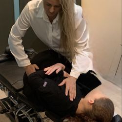 Hughes Chiropractic and Massage - Dr. Hughes adjusting a patient.